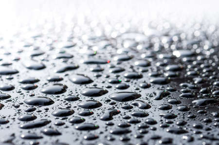 drops on the glass surface of the matrix TFT monitor closely, background