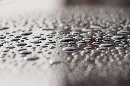 drops on the glass surface of the matrix TFT monitor closely, backgroundの写真素材