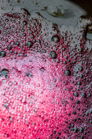 Bubbles of red wine from the different foreshorteningの写真素材