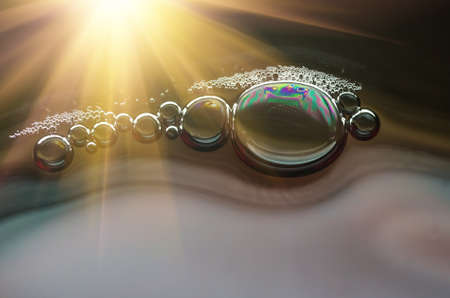 Bubbles in a glass of red wine closeの写真素材