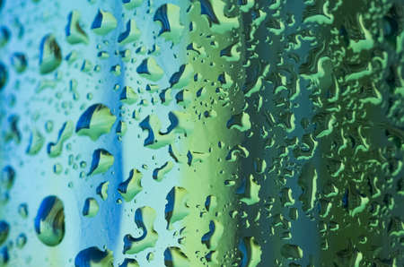 Texture water drops on the green bottleの写真素材