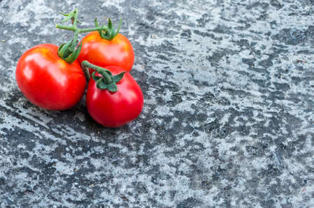 ripe red tomatoes lying on the ground, backgroundの写真素材