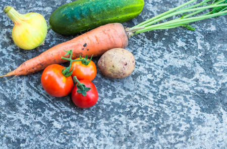 a lot of vegetables carrot cucumber onion potato tomato closeの写真素材