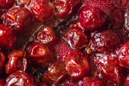 Cherry delicious red jam in the preparation of backgroundの写真素材