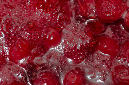 Cherry delicious red jam in the preparation of backgroundの写真素材