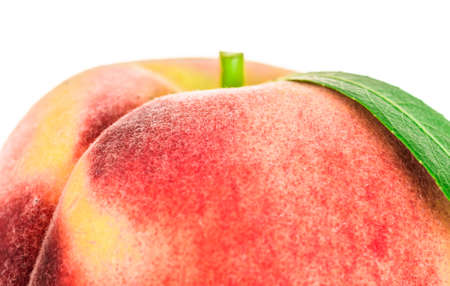Peach with green leaf isolated on white backgroundの写真素材