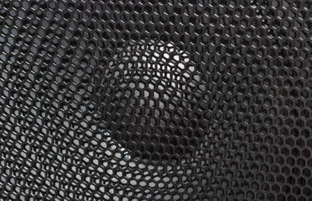 large speaker music loudspeaker with protective grille black. close-up, backgroundの写真素材