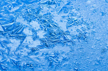 Texture, patterns on pond ice on Christmas Eve. Winter background