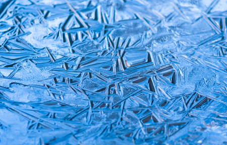 Texture, patterns on pond ice on Christmas Eve. Winter backgroundの写真素材