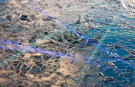 Texture, patterns on pond ice on Christmas Eve. Winter backgroundの写真素材