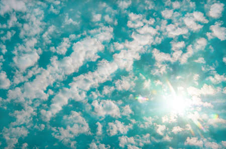 clouds in the blue sky and sun, natural backgroundの写真素材
