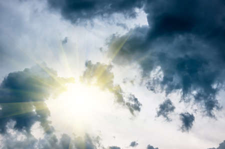 large dark clouds and sun before a storm, natural backgroundの写真素材