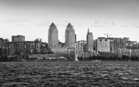 Towers twin on the river bank in the great Ukrainian city of the Dnipro, black and white toning, backgroundの写真素材