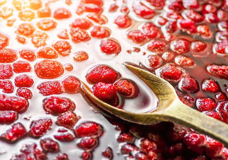 Delicious useful strawberry red jam, homemade, closeup backgroundの写真素材