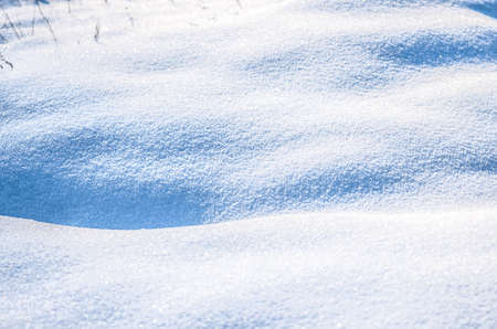 Beautiful fresh snow pattern in minimalistic style. Winter background. Close up texture.