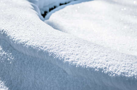 Beautiful fresh snow pattern in minimalistic style. Winter background. Close up texture.の写真素材