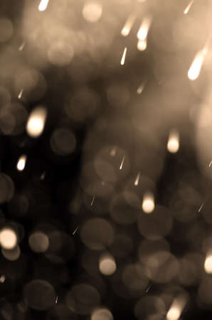 Falling snow on black background. Snow closeup.