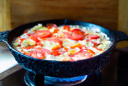 Omelet with pepper tomatoes close up for breakfast