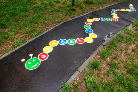 Childrens active play drawn on the sidewalk close-upの写真素材