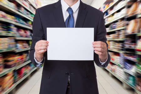 Businessman holding a blank sheetの写真素材