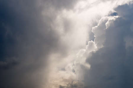 Blue sky background with white clouds.