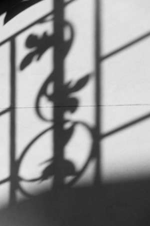 Light and shadow on tiles floor in the dark room.の写真素材