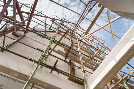 Bamboo Scaffolds for construction job. It's made us easy to climbing onto a parts of the building.の写真素材