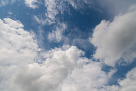 Blue sky background with a white clouds in a sunny day.の写真素材