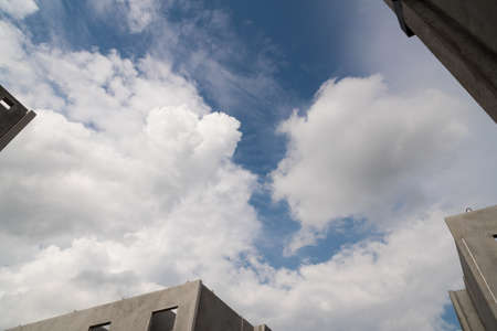 Blue sky background with a white clouds in a sunny day.