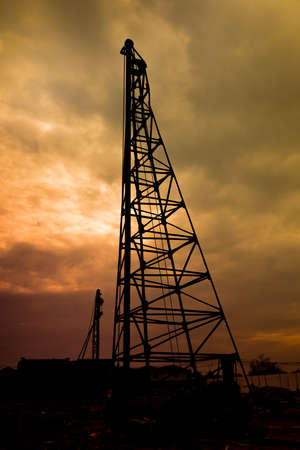 Silhouette background of piling works machine in construction site.