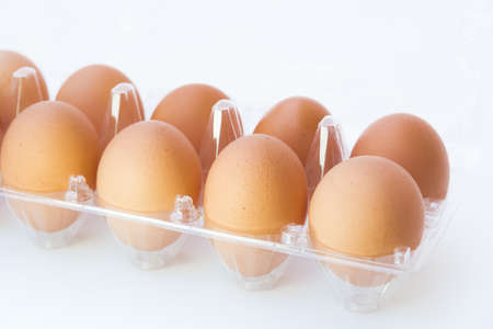 Chicken eggs in a plastic pack isolated on white background.