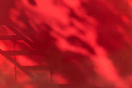 Red wall and shadow background of playground in the park.の写真素材