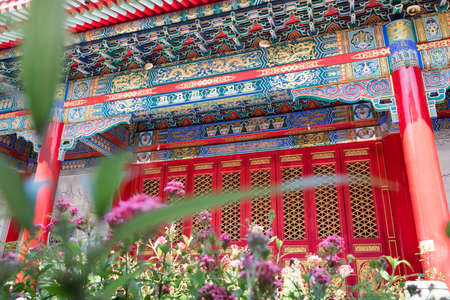 Traditional and architecture red door chinese style temple at Wat Mangkon Kamalawat or Wat Leng Noei Yi in Nonthaburi,Thailand.の写真素材