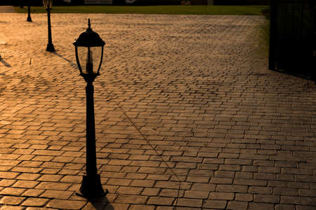 Vintage lanterns on stamp concrete floor.の写真素材