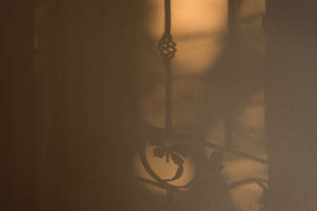 Abstract background of a white wall with shadows from the window.