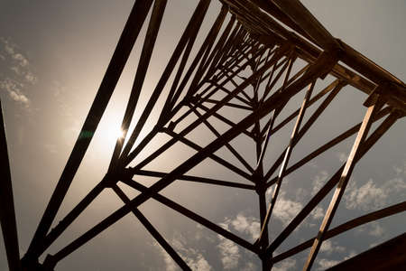 Steel frame of piling machine against blue sky background.の写真素材