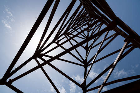 Steel frame of piling machine against blue sky background.の写真素材