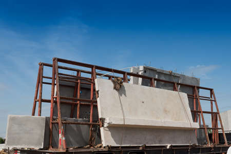Precast concrete wall panel on the trailer prepare for installation building.の写真素材