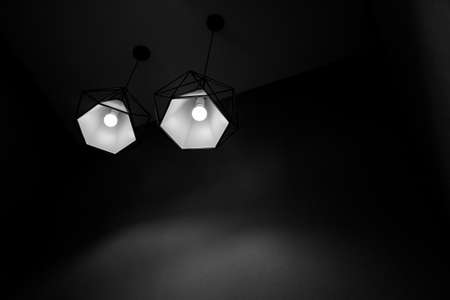 Two pendant lamps hanging on ceiling. Contemporary Design in black and white shade.の写真素材