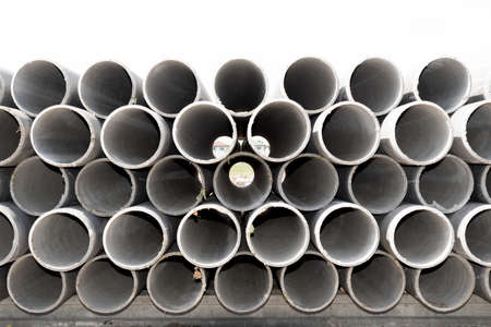Asbestos cement pipes used for drainage construction. Isolated on white background.の写真素材