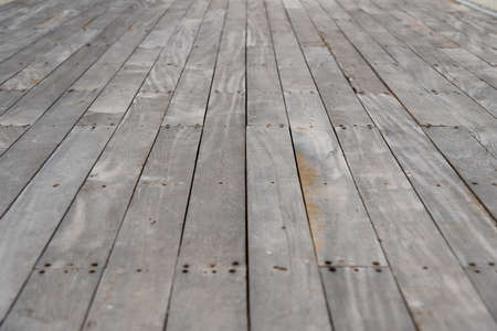 Old gray wooden board Use as a walkway in the garden.の写真素材