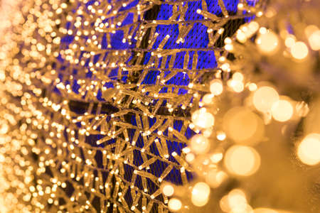 Bulbs glitter in tunnel lights and gold bokeh background, Blurred background.