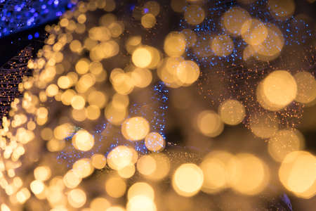 Christmas bokeh lights refocused blurred background, Abstract texture.