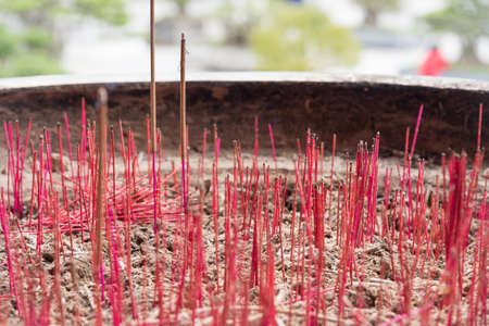 Many joss stick burned in the joss stick jar.の写真素材