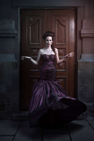 Beautiful woman in violet dress