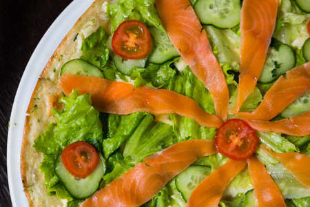 Appetizing pizza with mozzarella cheese and seafoodの写真素材