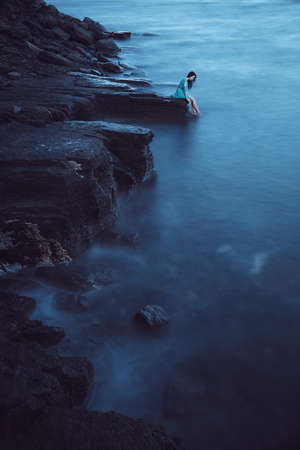 Beautiful young woman on seaの写真素材