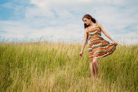 Woman walking in fieldの写真素材