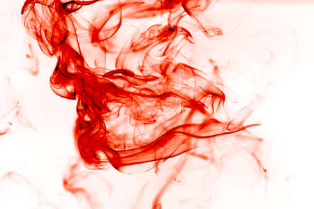 Red Ink in Water on white backgroundの写真素材