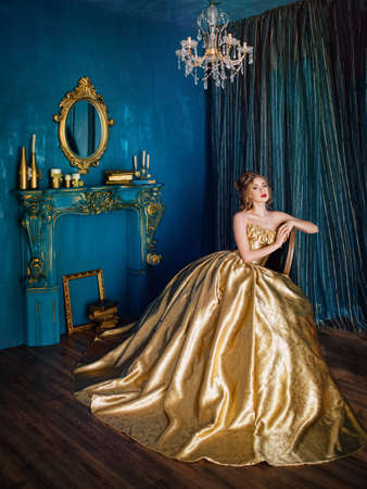 Beautiful woman in a ball gownの写真素材